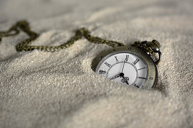 pocketwatch in sand